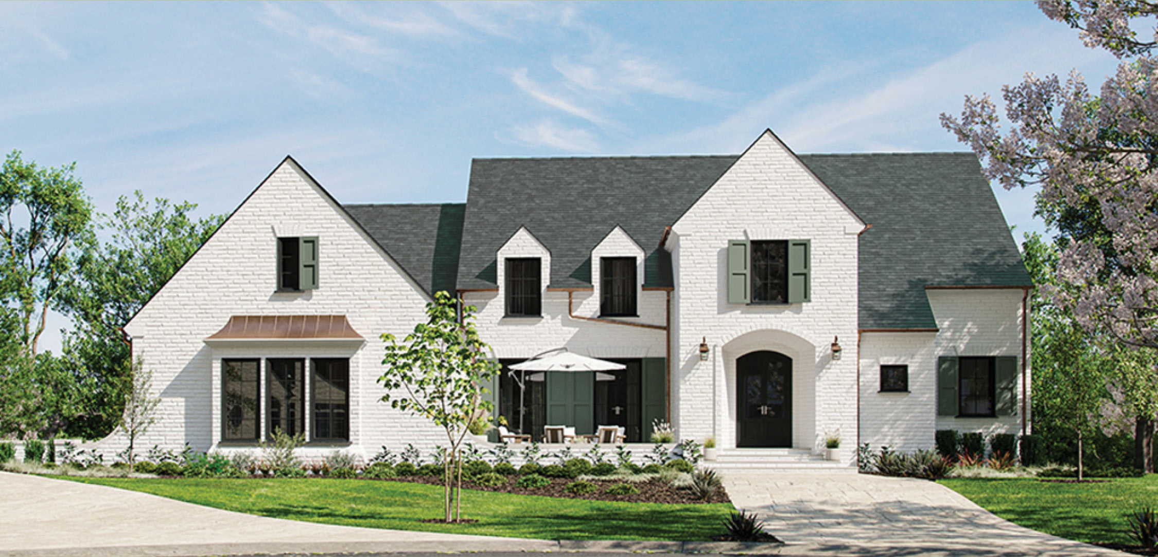 White painted-brick exterior with a copper standing-seam awning, sage shutters and a slate roof